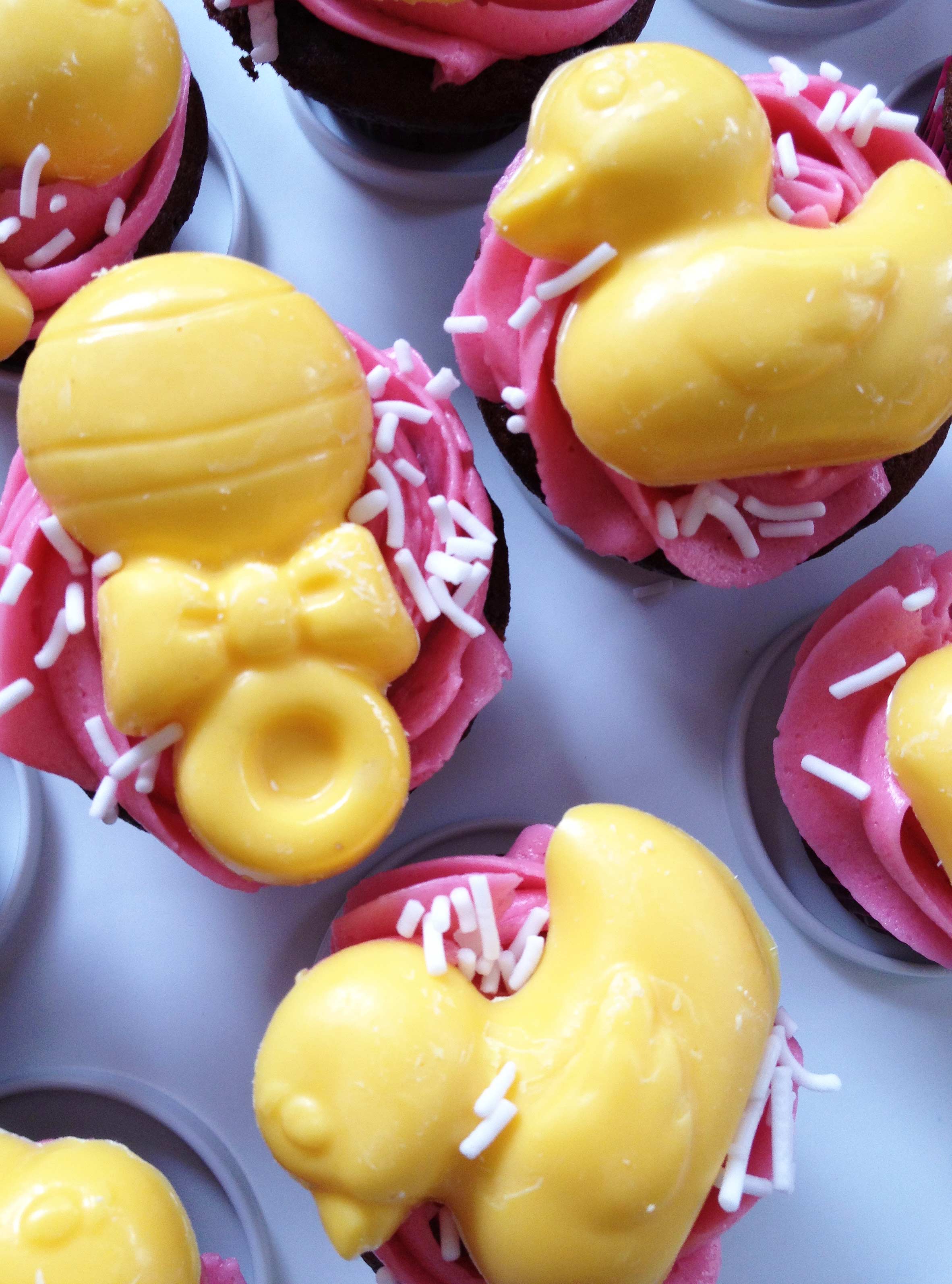 Yellow duckies and rattles cupcakes