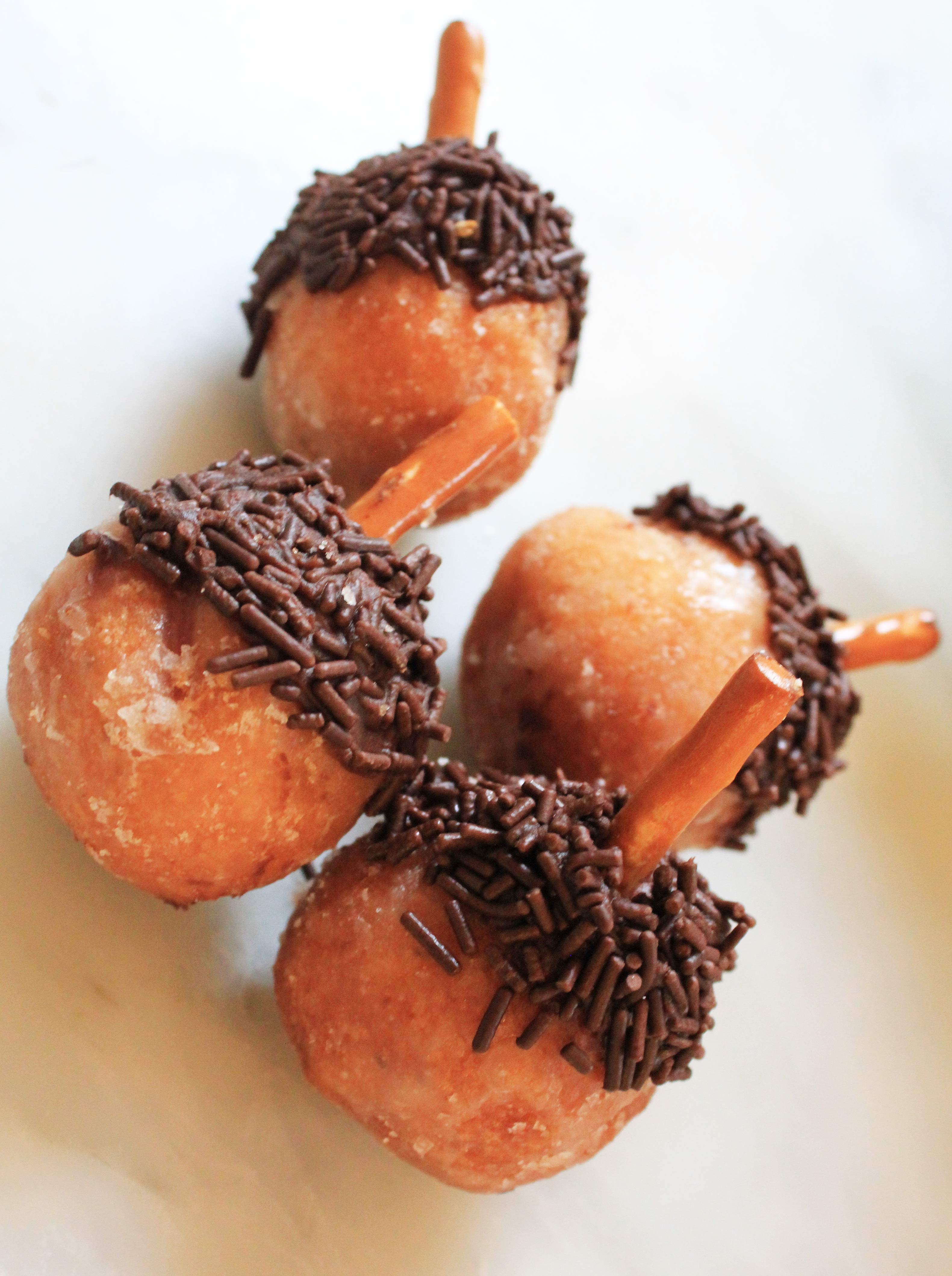 Chocolate sprinkle-covered acorn donuts